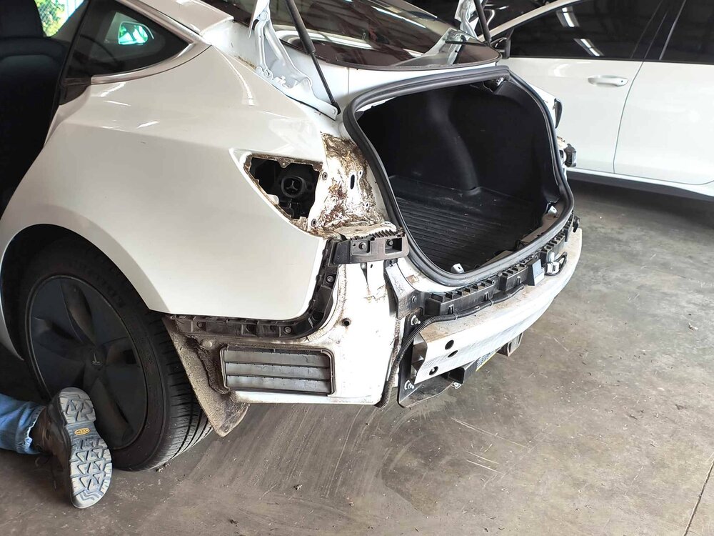 Tesla Model 3 with rear bumper removed for repair