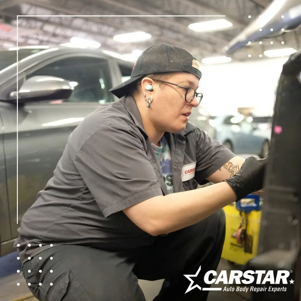 A Murray's CARSTAR technician working on a vehicle in the shop